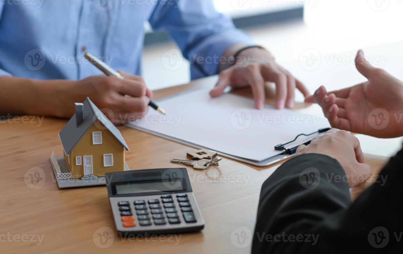 Signing of a contract of sale between the buyer and seller. photo