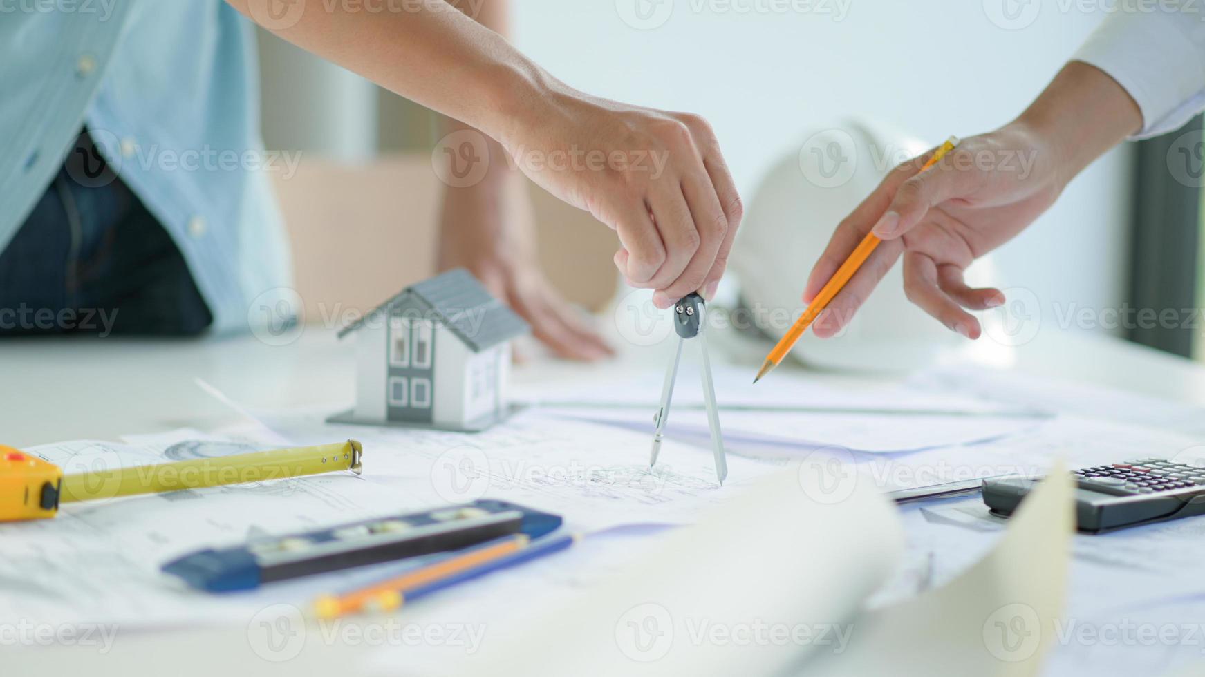 Engineers and architects design and plan the construction of new project buildings. photo