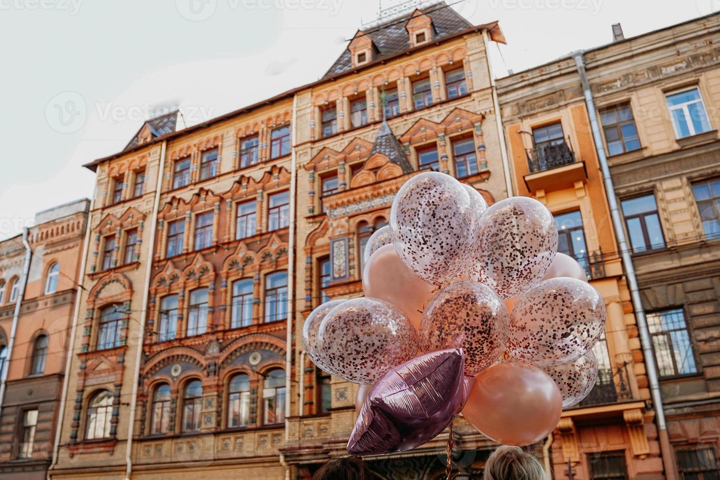 Old brick house and balloons, St-Petersburg, Russia. 19 September 2021 photo