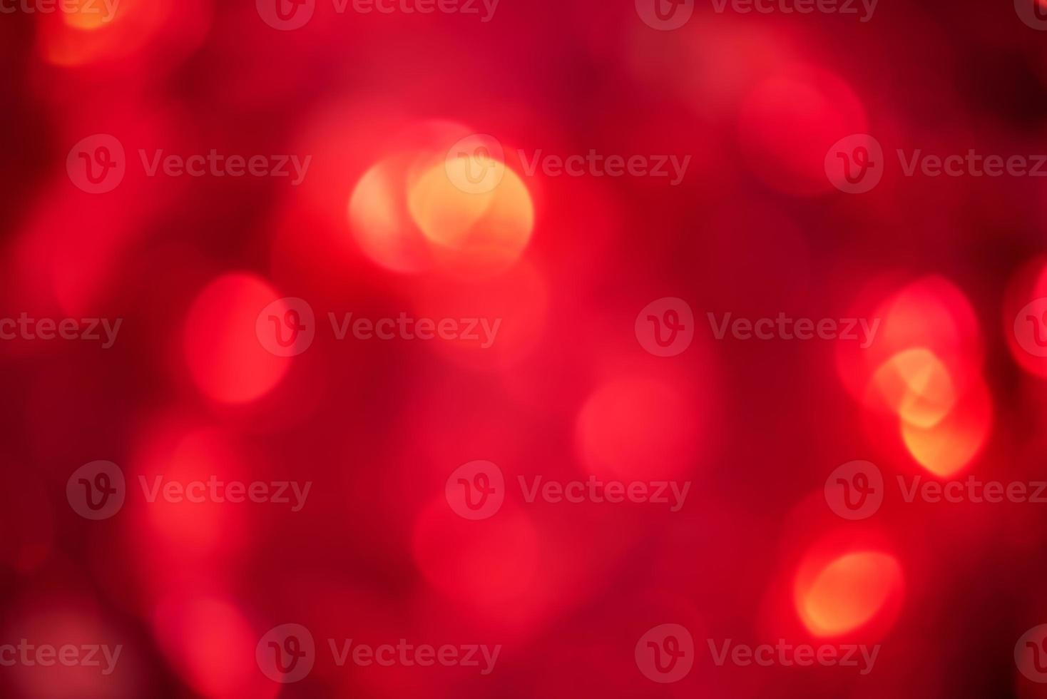 Defocus light red glare. Glitter as an abstract background. photo