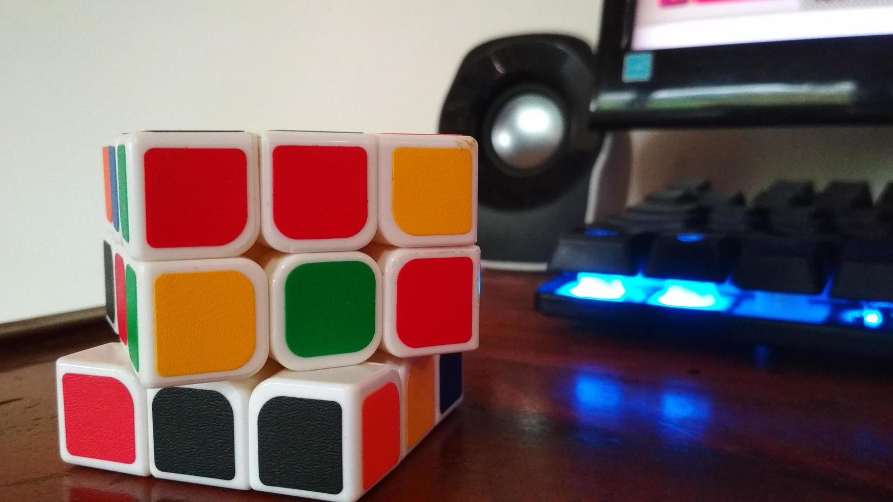 Color rubik's photo with glowing keyboard background