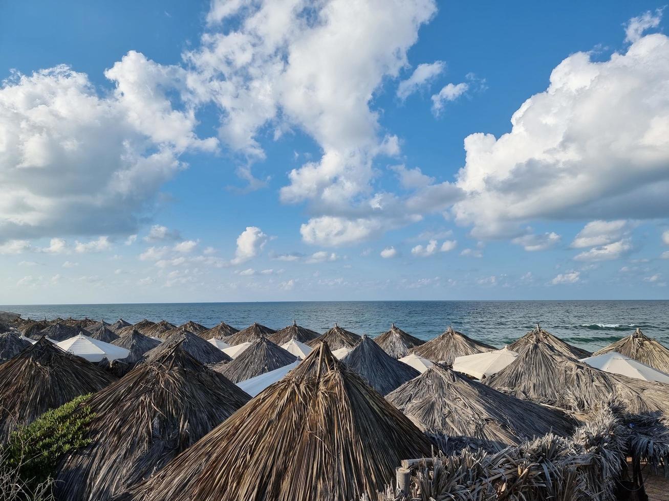 Wooden hut on the beach with sky photo