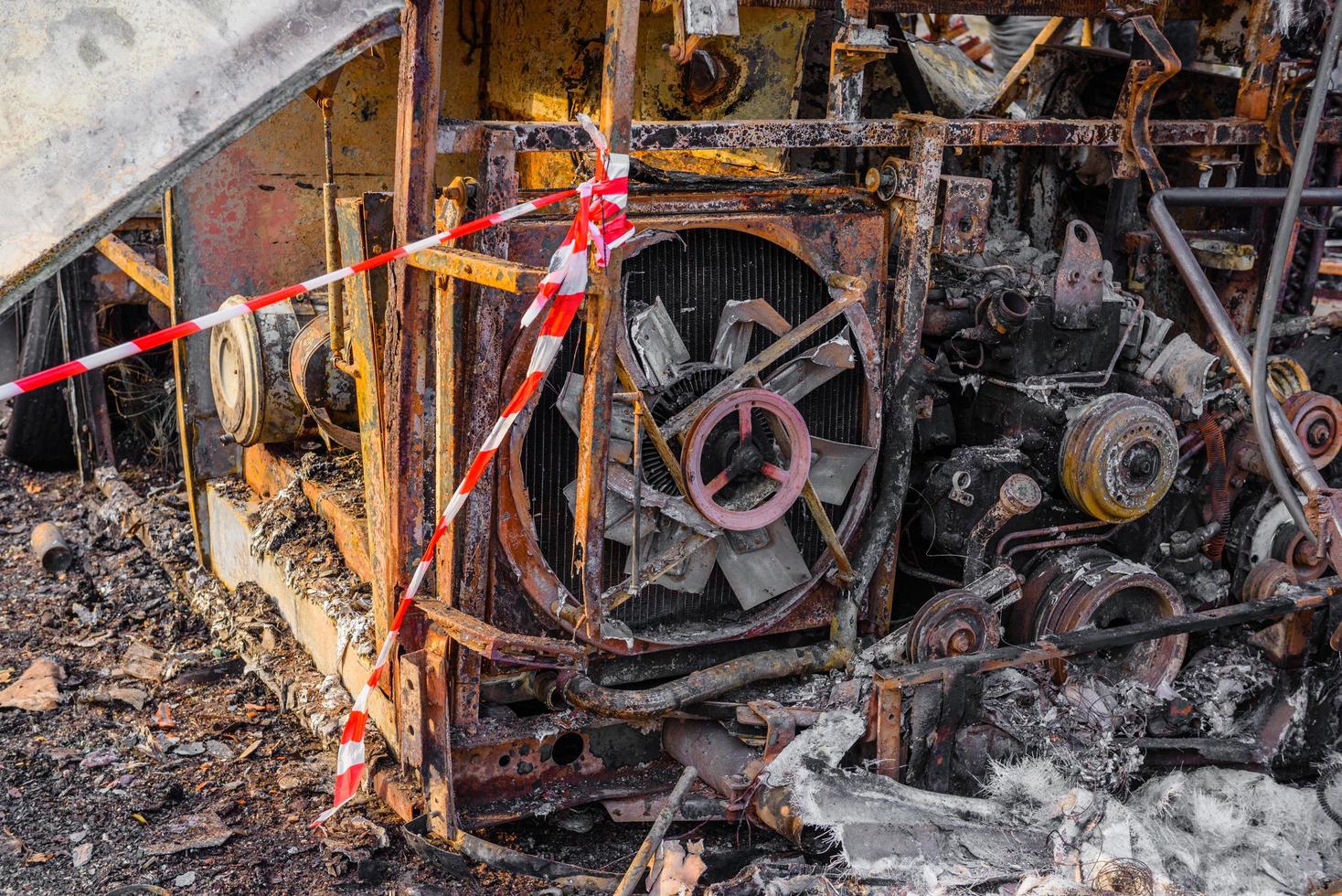 Burnt bus is seen on the street after caught in fire during travel, after fire photo