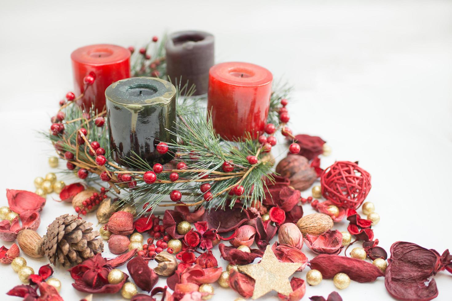 Christmas crown with green and red candles photo