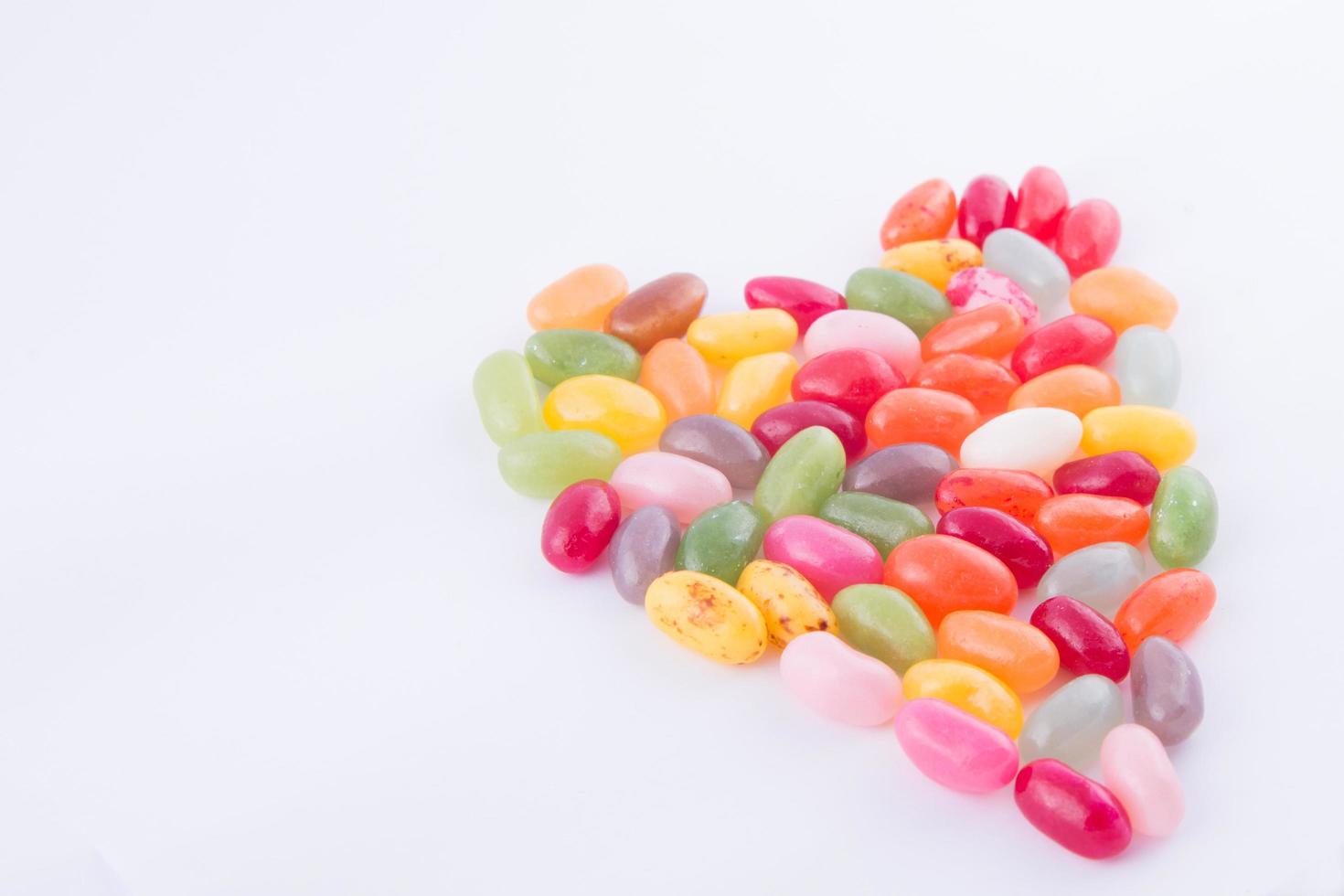 Colorful and tasty heart of candies photo