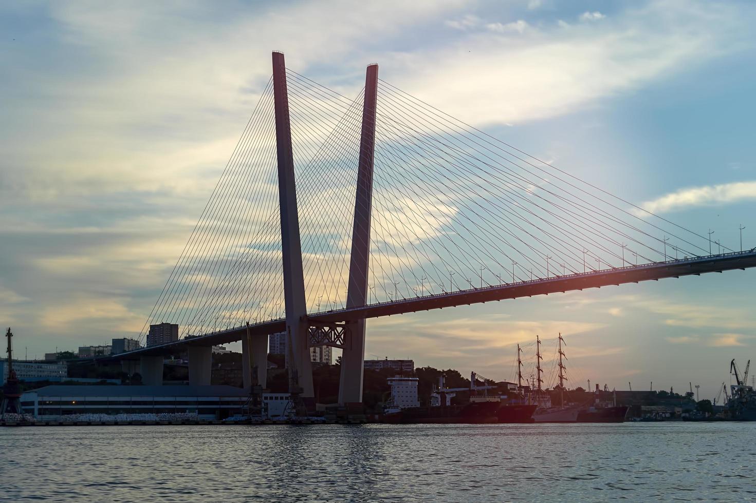 Urban landscape with a view of the Golden Bridge. Vladivostok, Russia photo