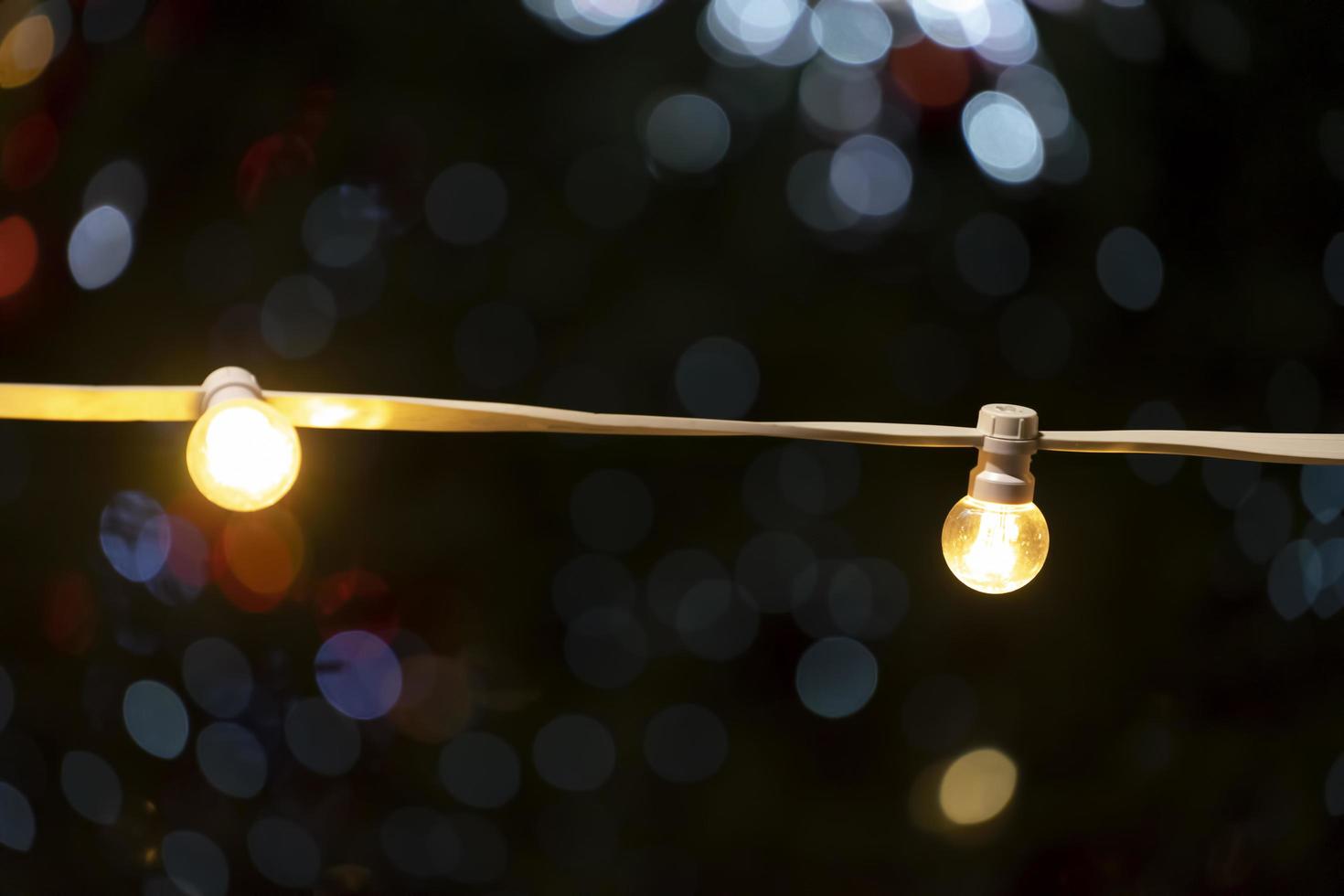 Yellow light bulbs on a blurry background with bokeh photo
