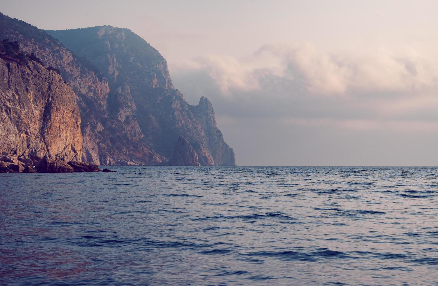 Seascape with views of the mountains near the coastline. photo