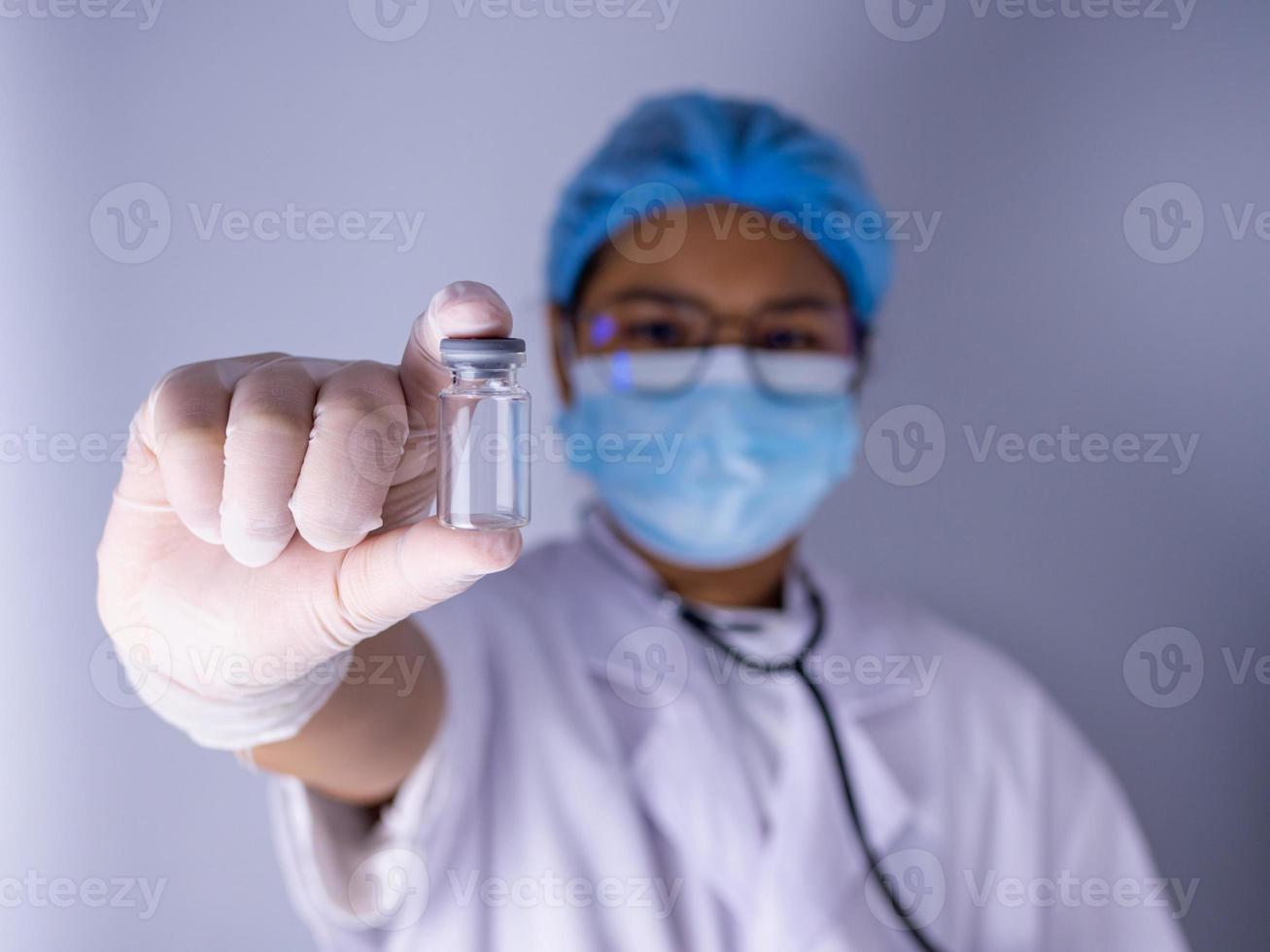 Portrait of a female doctor wearing a mask photo