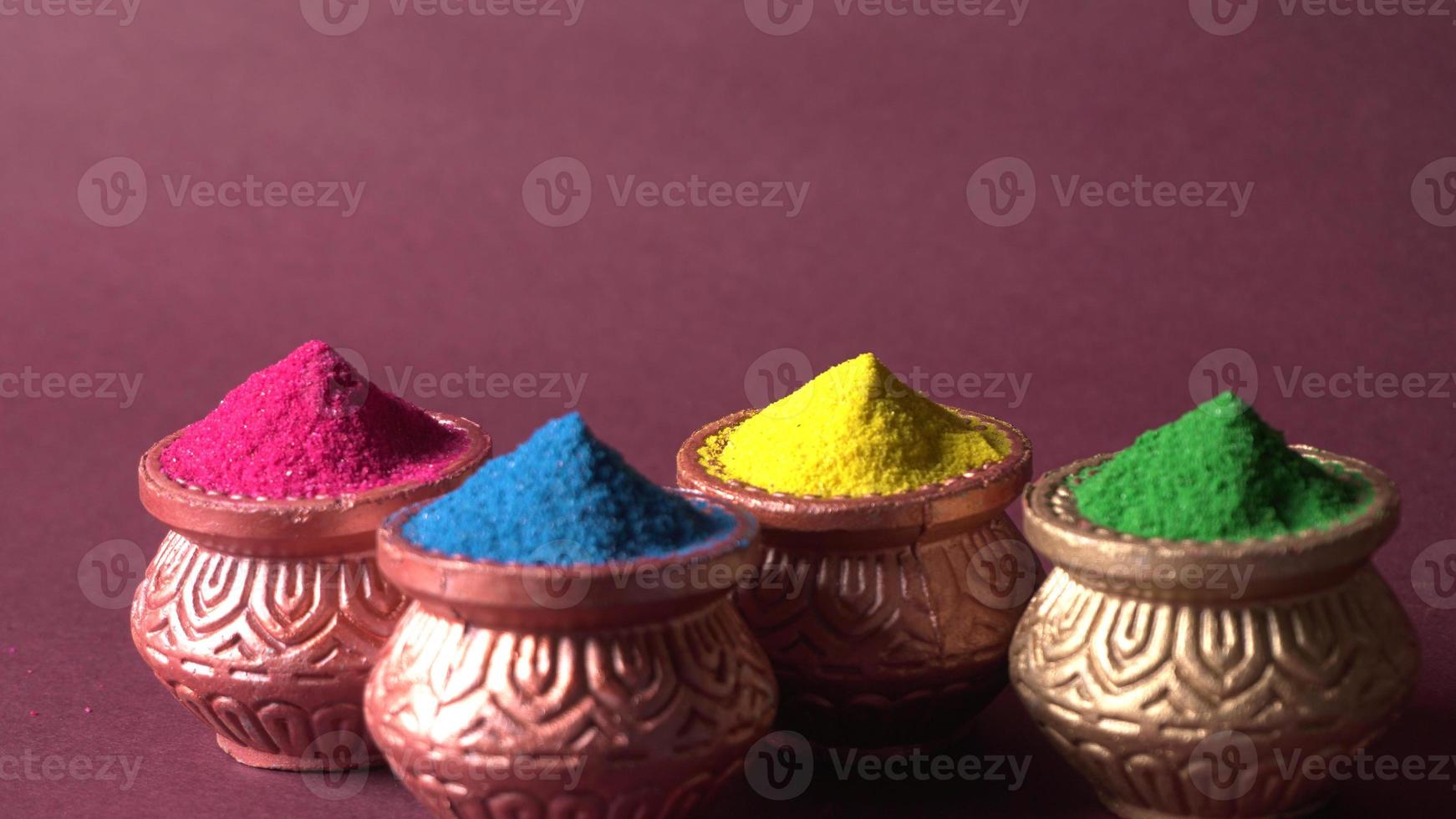 Colourful rangoli in bowls photo