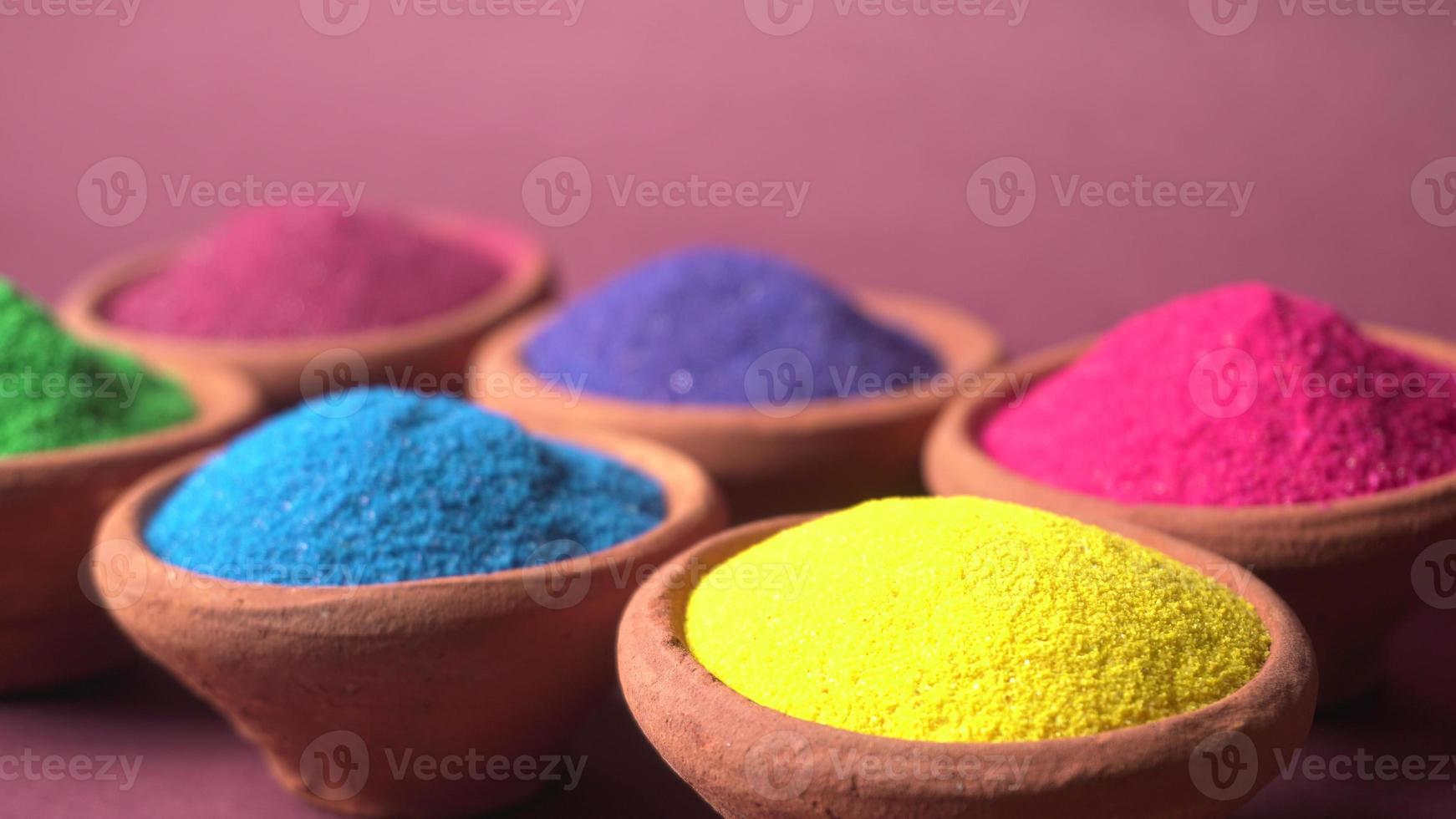 Colourful rangoli in bowls photo