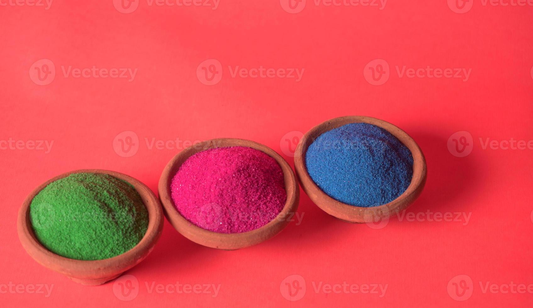 Colourful rangoli in bowls photo