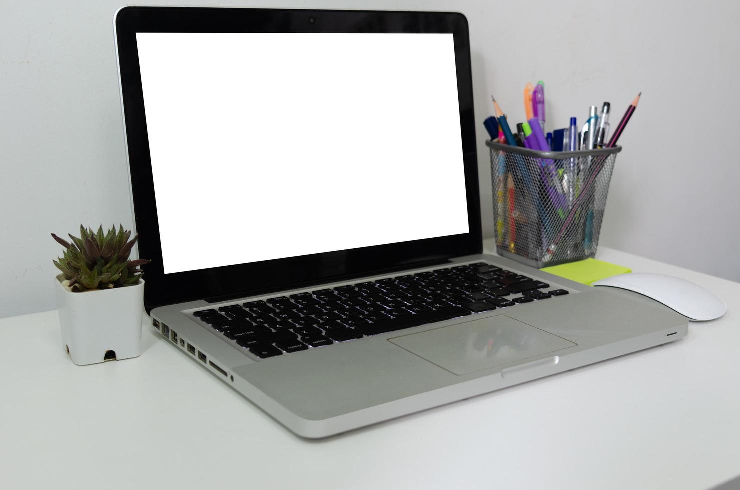 Computer laptop mock up blank white touch screen on desk. Used to put text or information to advertise news or sell products online. concept marketing business photo