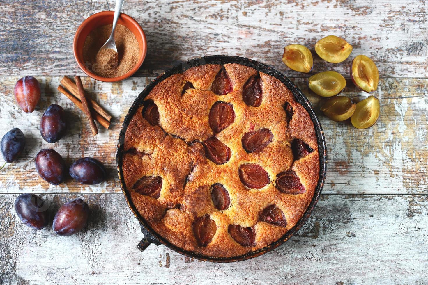 Slice of plum pie on a fork. Homemade American plum pie. photo