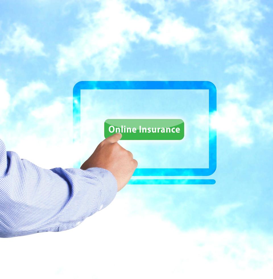 Hand pressing online insurance photo