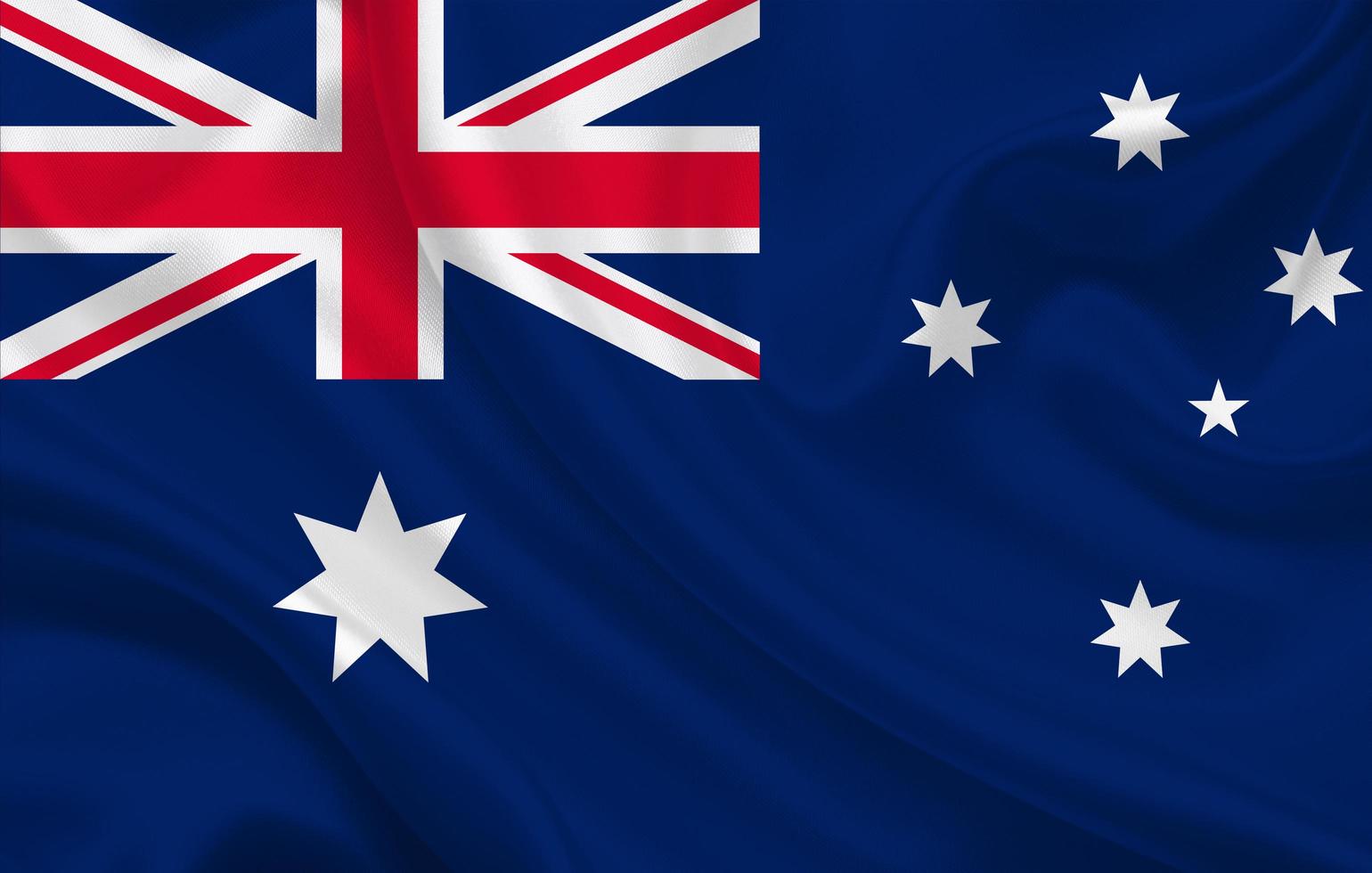 Australia la bandera del país sobre fondo de tela de seda ondulada foto