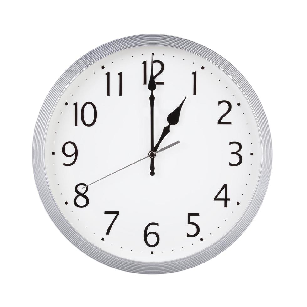 Exactly one hour on round clock face photo