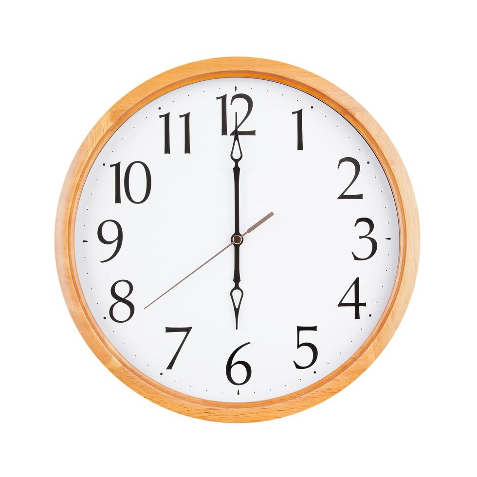 Six o'clock on a round clock photo