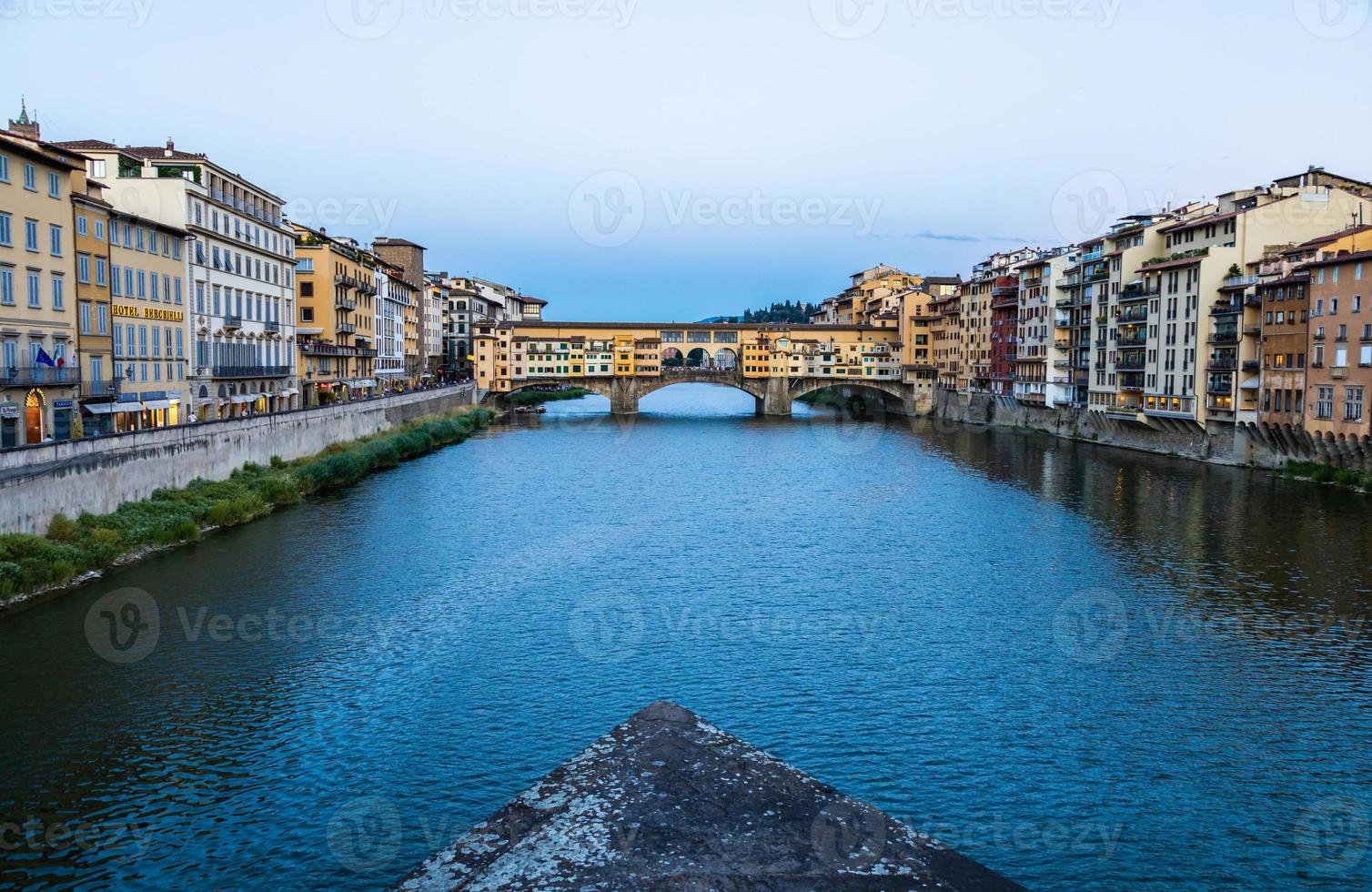 Sunset on Ponte Vecchio - Old Bridge - in Florence, Italy. Amazing blue light before the evening. photo