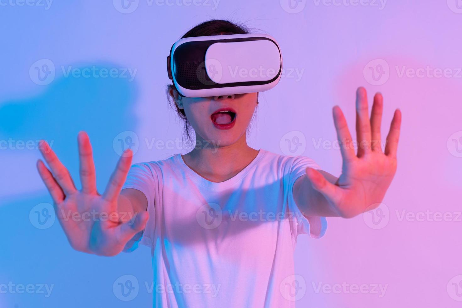 portrait of young asian girl wearing virtual reality glasses photo