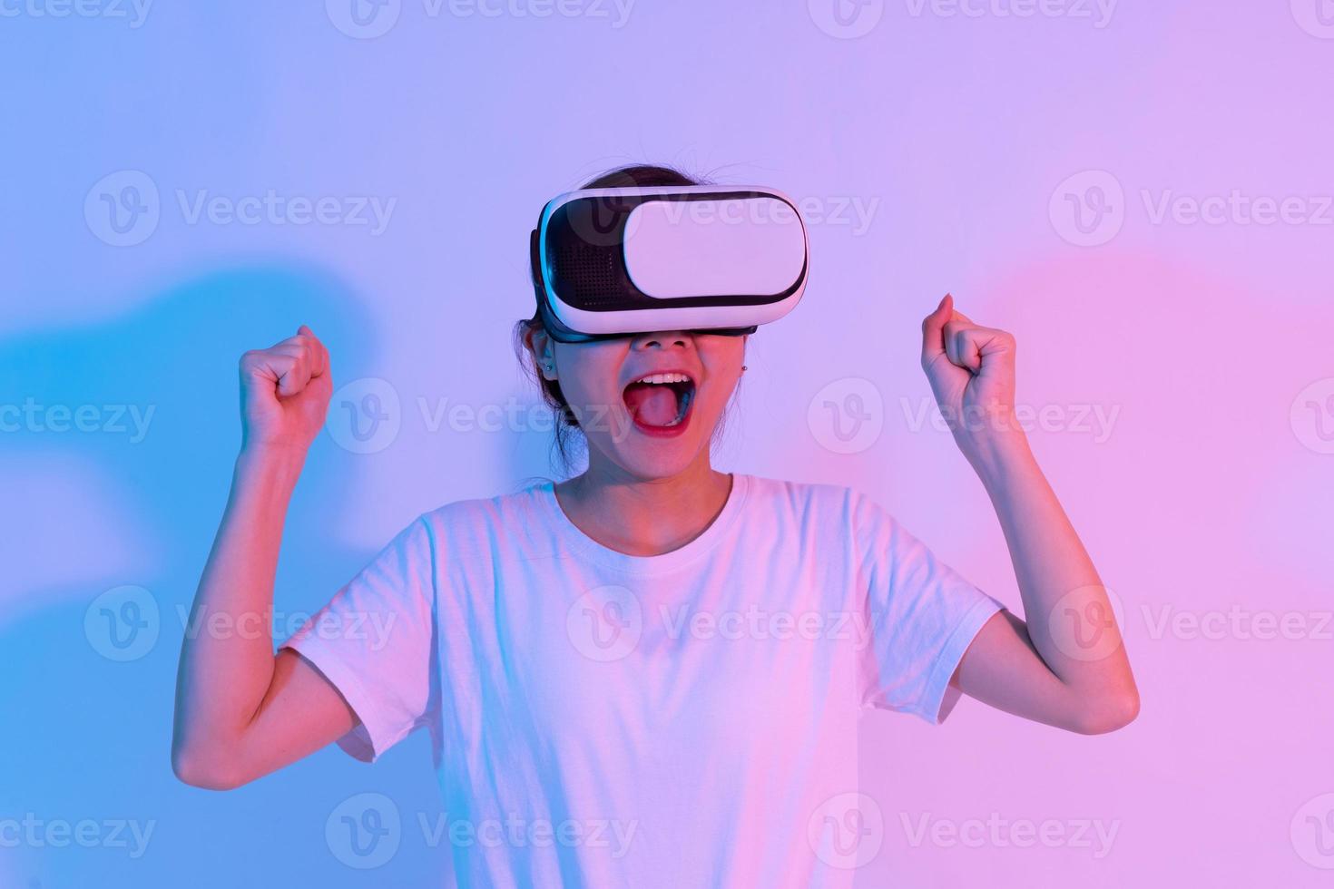 portrait of young asian girl wearing virtual reality glasses photo