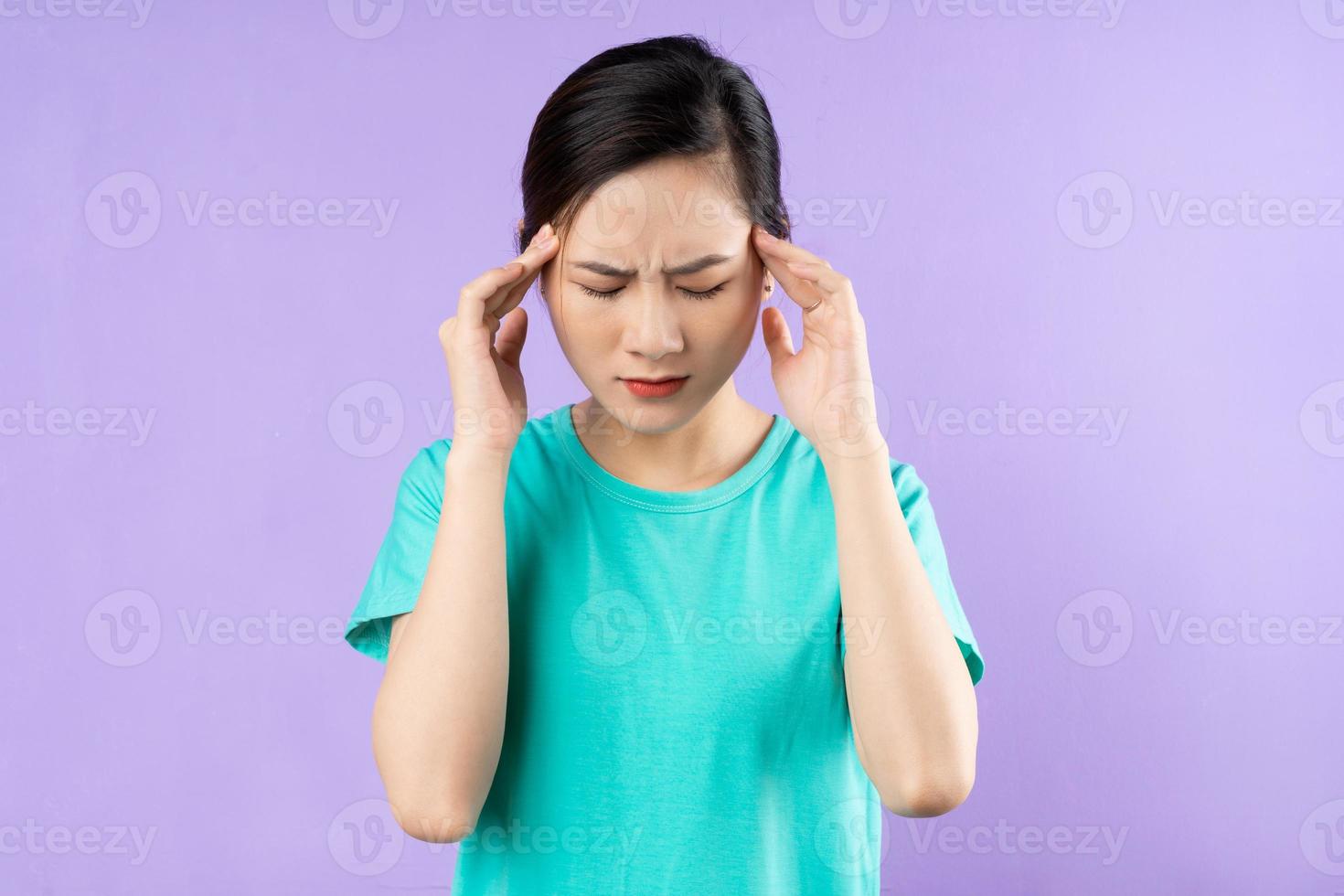 beautiful asian woman portrait, isolated on purple background photo