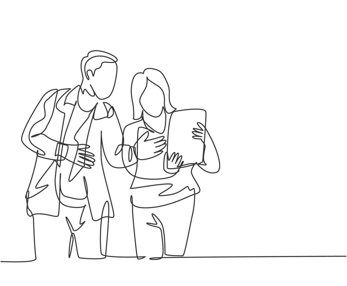 One continuous line drawing of young startup members check the work each others using laptop and tablet. Business process teamwork concept. Single line draw design vector illustration