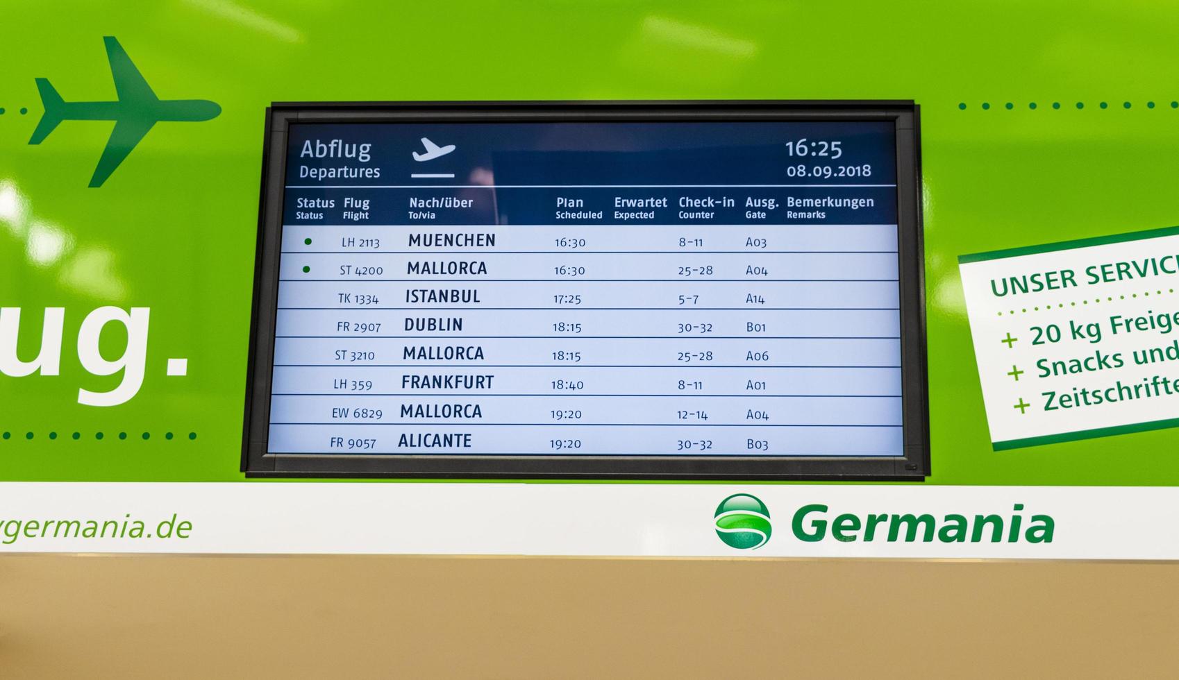 Germania Airlines green timetable for departures arrivals Airport Bremen Germany. photo