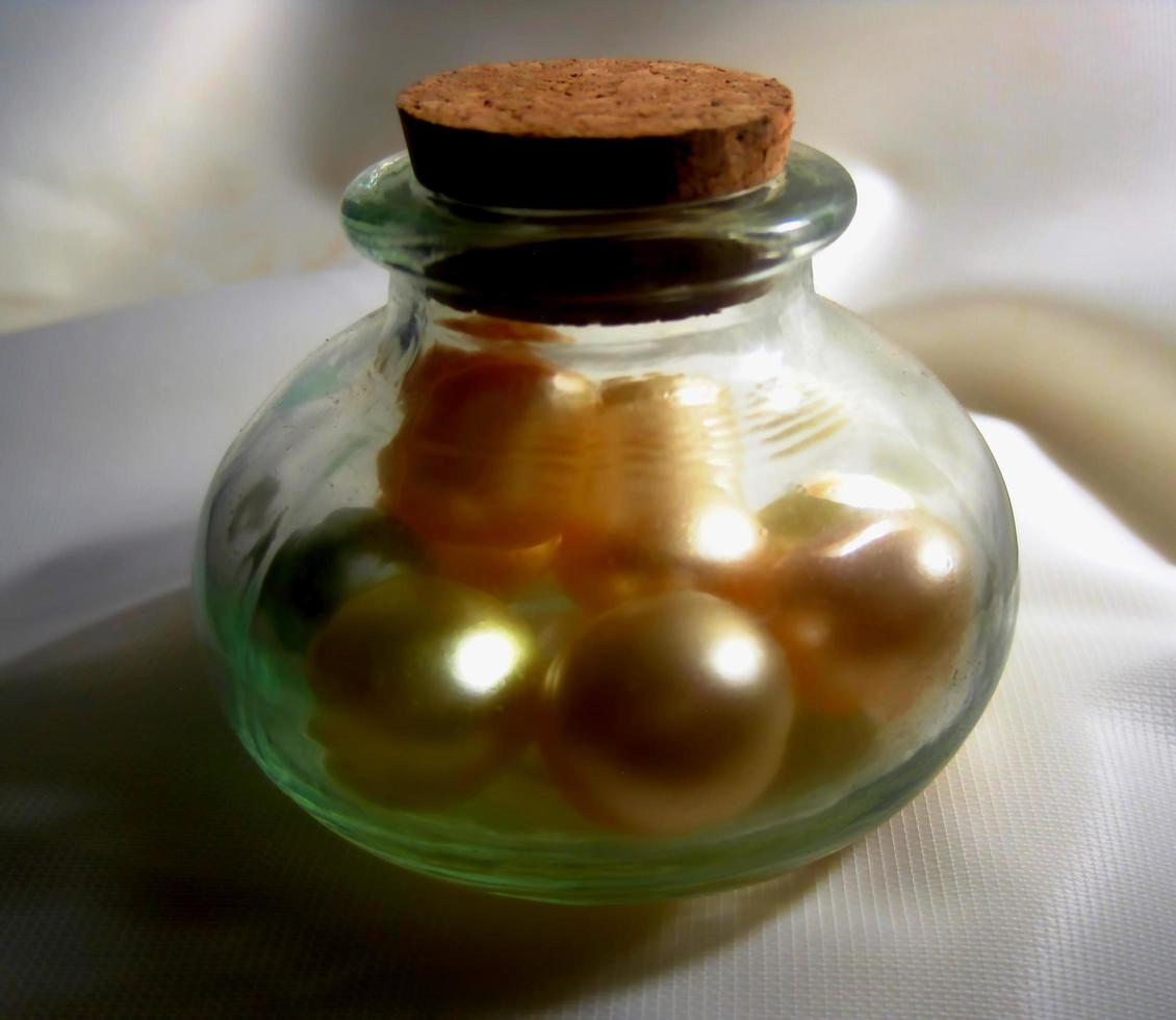 Colorful shinning beads in the jar photo