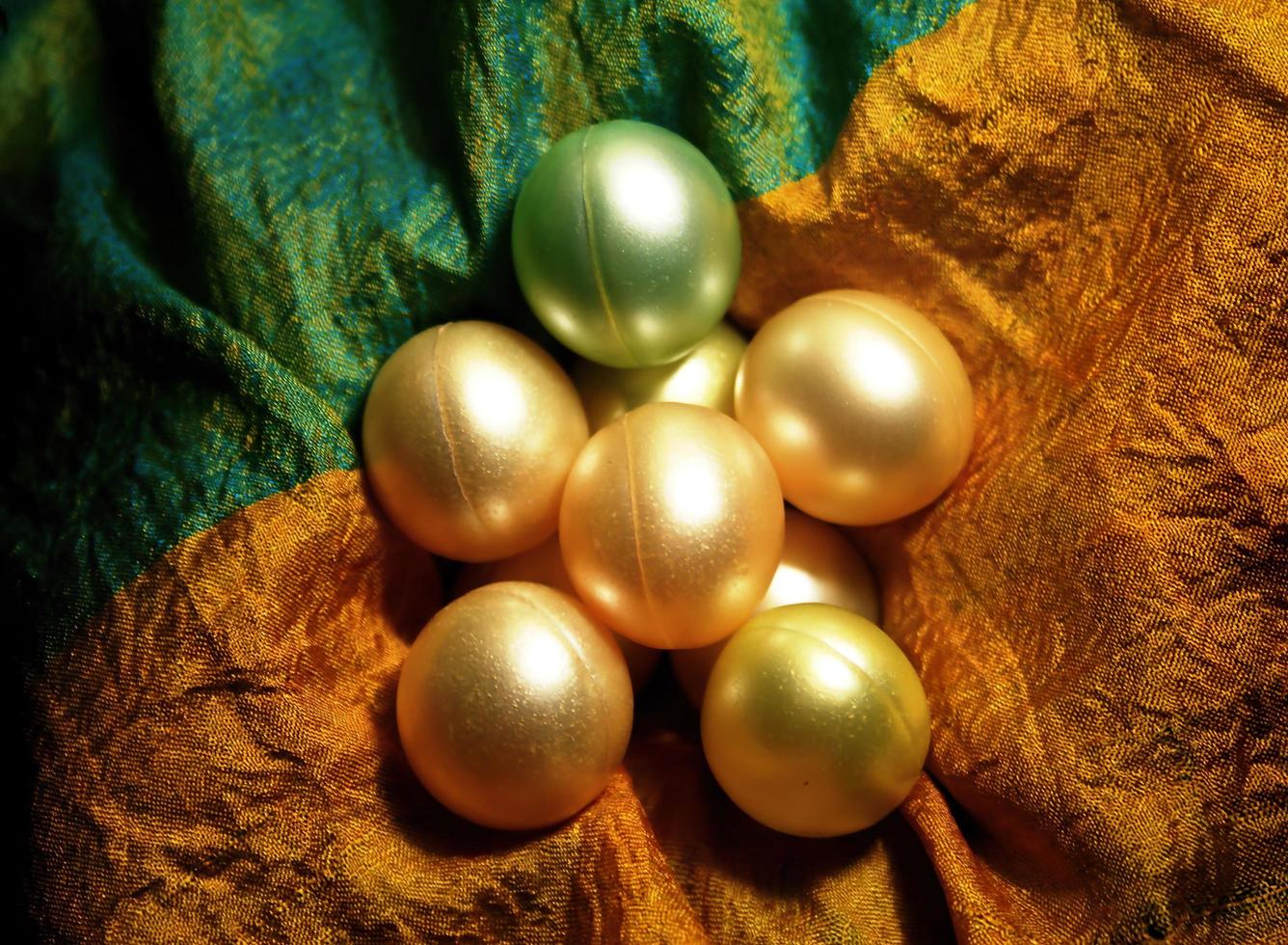 Colorful shinning beads on shinning cloth photo