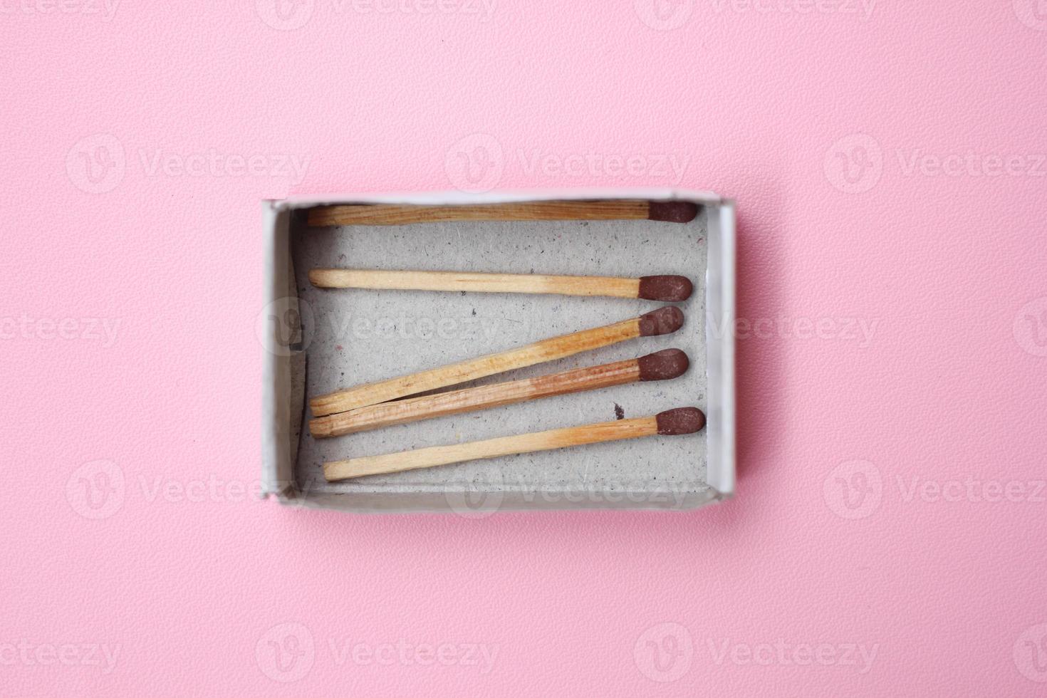 Matches stick box on pink background photo