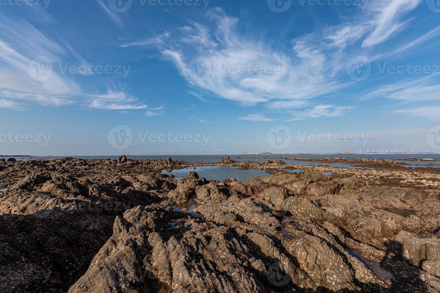 Yellow reef and sea under the blue sky photo