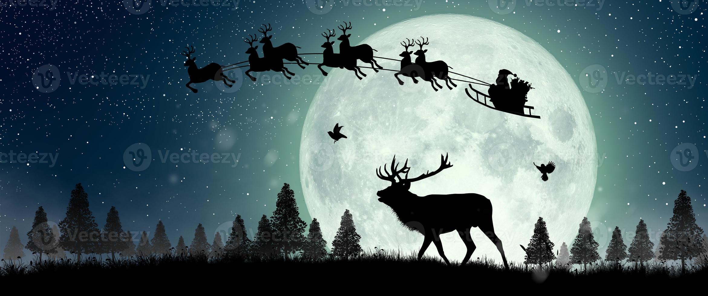 Silhouette of Santa Claus flying over the full moon photo
