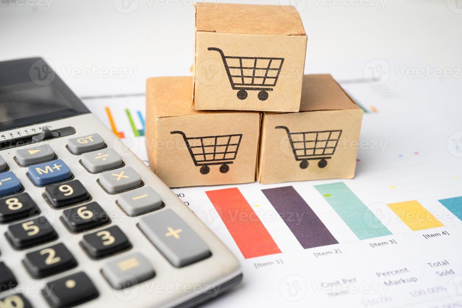 Shopping cart logo on box with magnifying glass on graph background. Banking Account, Investment Analytic research data economy, trading, Business import export transportation online company concept. photo