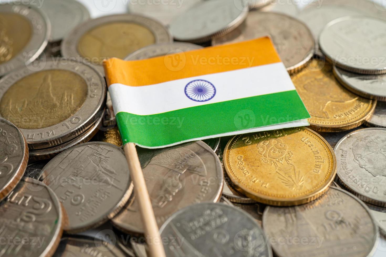 India flag on coins background, finance and accounting, banking concept. photo