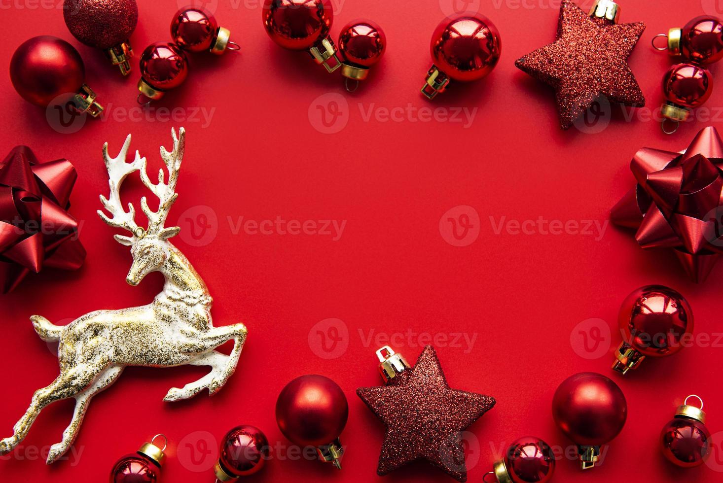 Red Christmas baubles decoration on red background with copy space photo