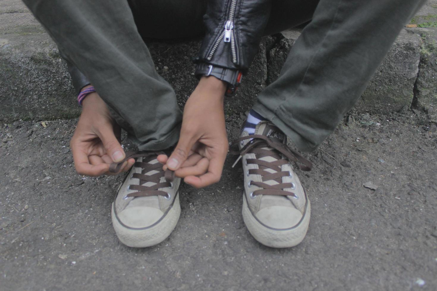 someone tying shoelaces photo