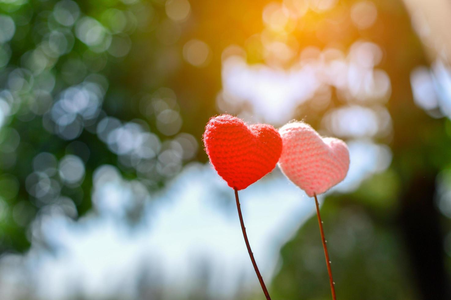 Yarn hear with nature background bokeh for valentines day photo