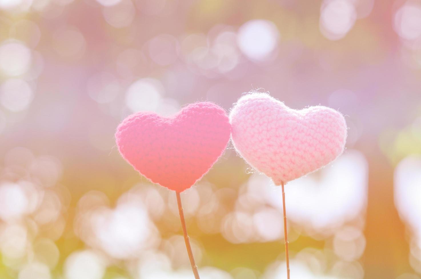 Yarn hear with nature background bokeh for valentines day photo