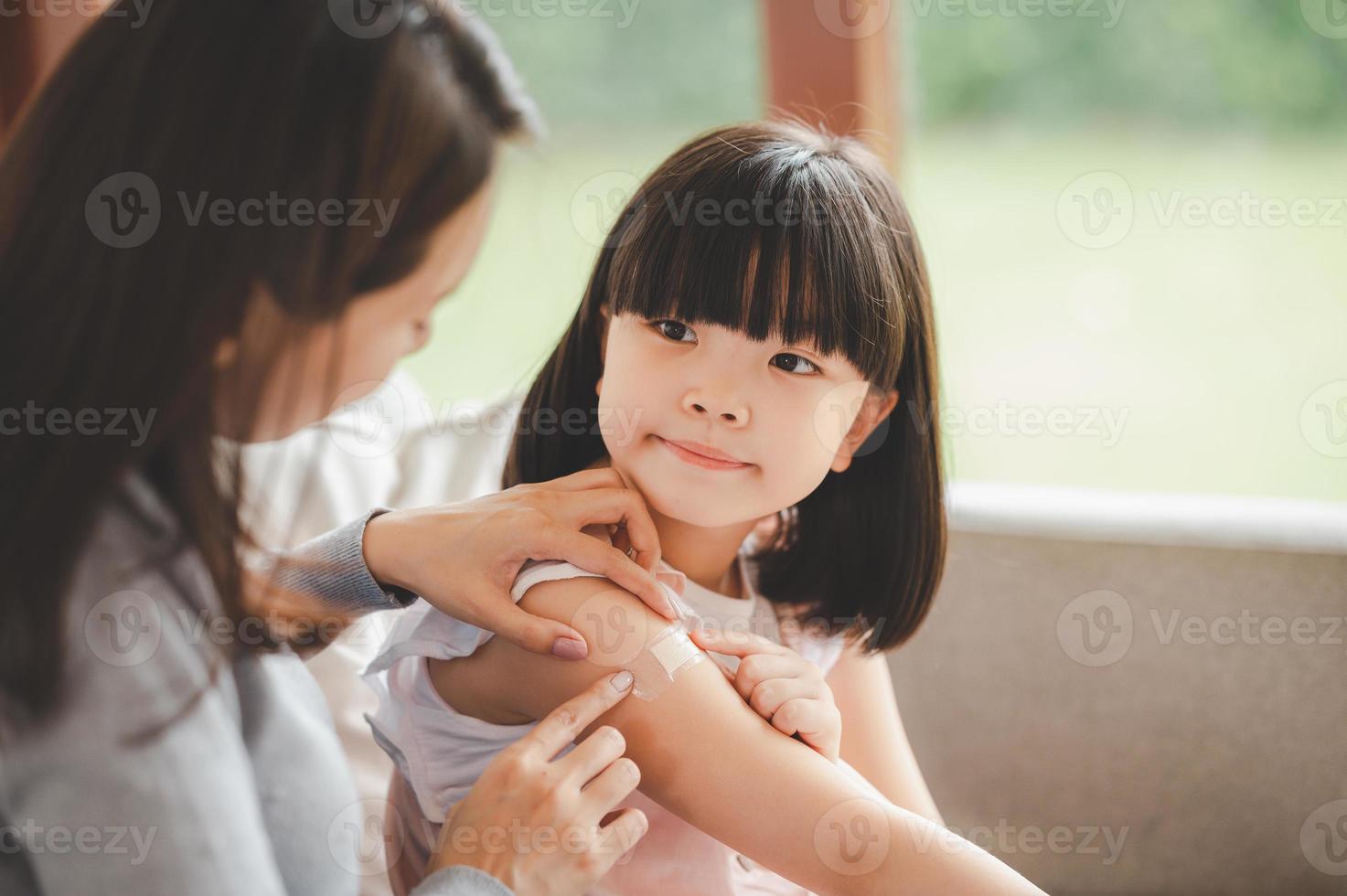 mother taking care of her daughter photo