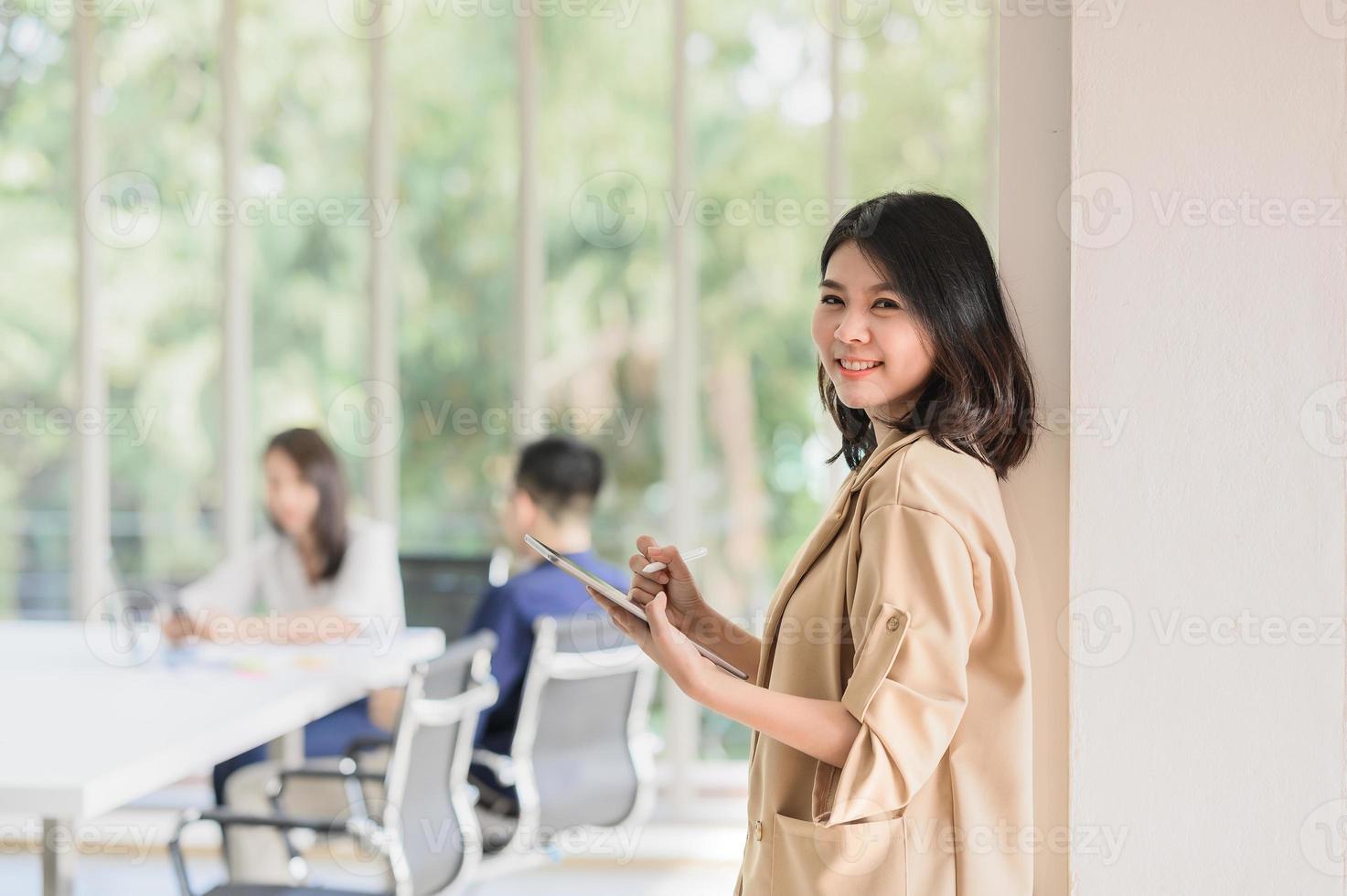 business woman using digital tablet in meeting room photo