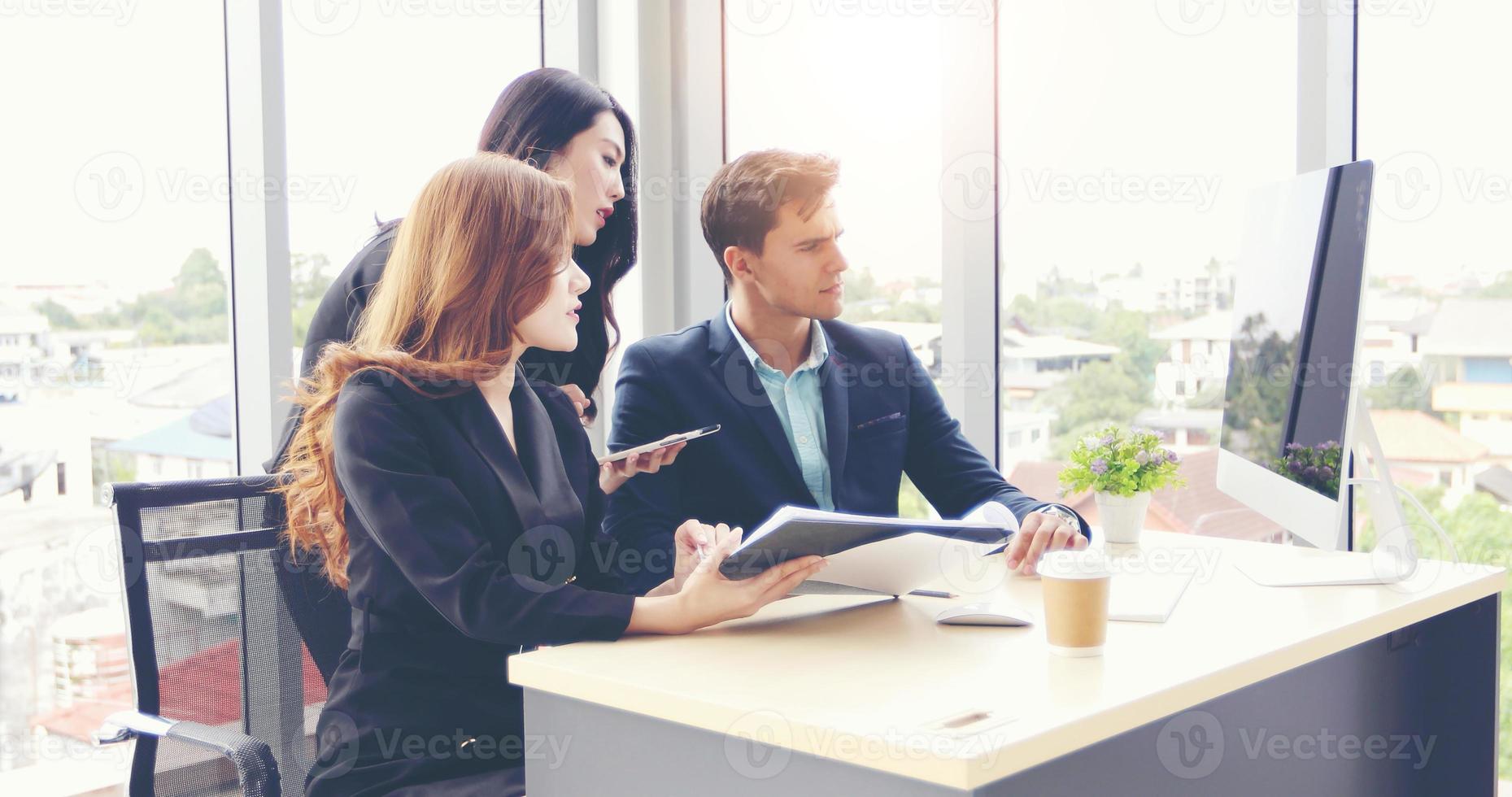 Businessmen and using notebook pc and tablet for discussing documents and ideas in meeting  and business serious for working photo