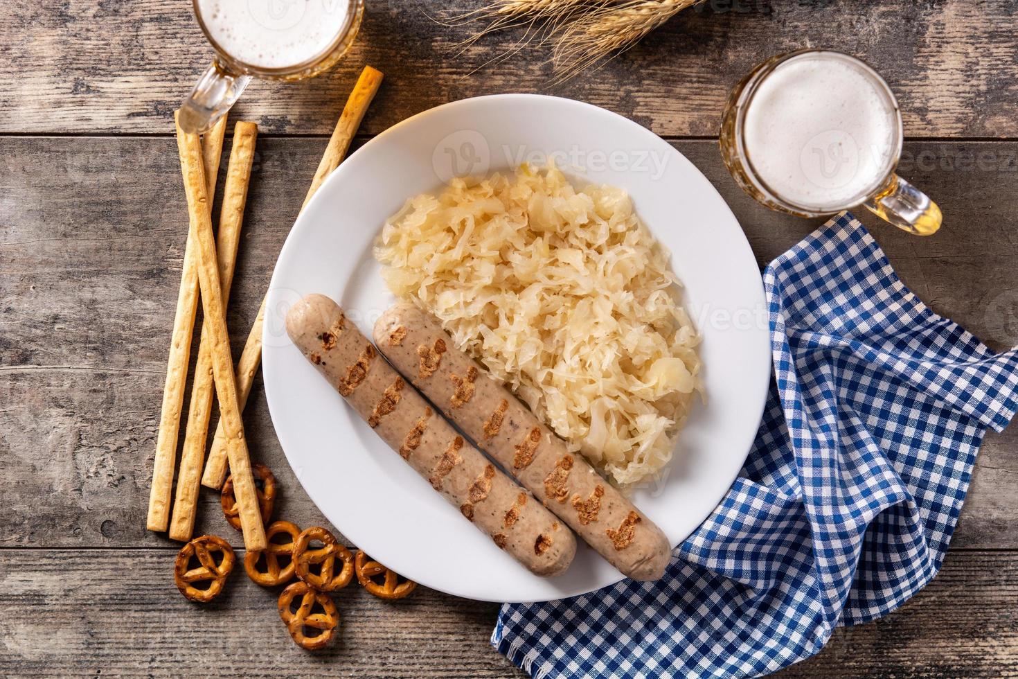 Bratwurst sausage ,sauerkraut, pretzels and beer photo