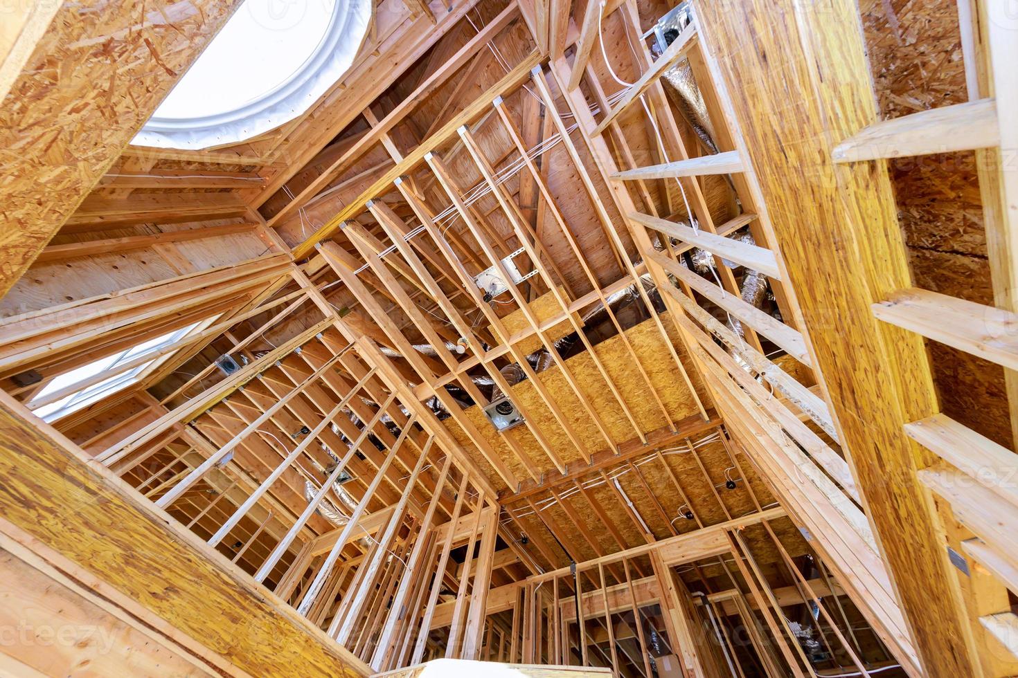Residential house with wooden frame under construction house installation the roof of the house photo