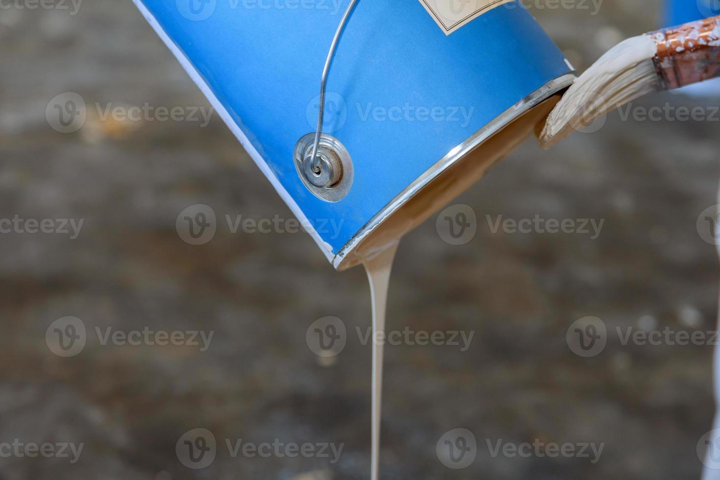 Pouring paint into a cuvette for repair close up photo