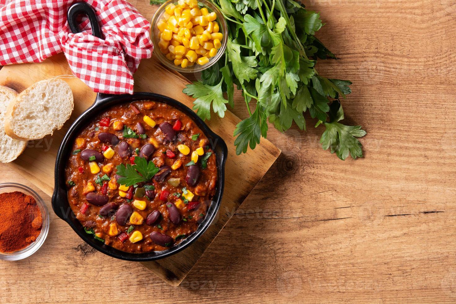 Traditional mexican tex mex chili con carne in iron pan photo