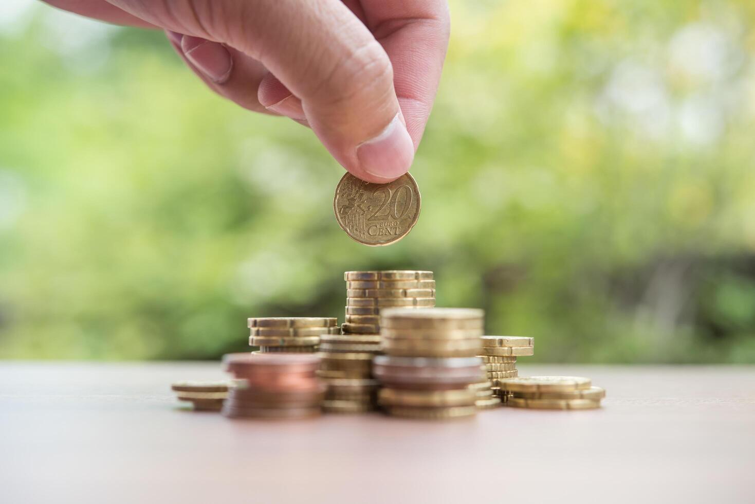 Saving money concept . hand putting money coin stack photo