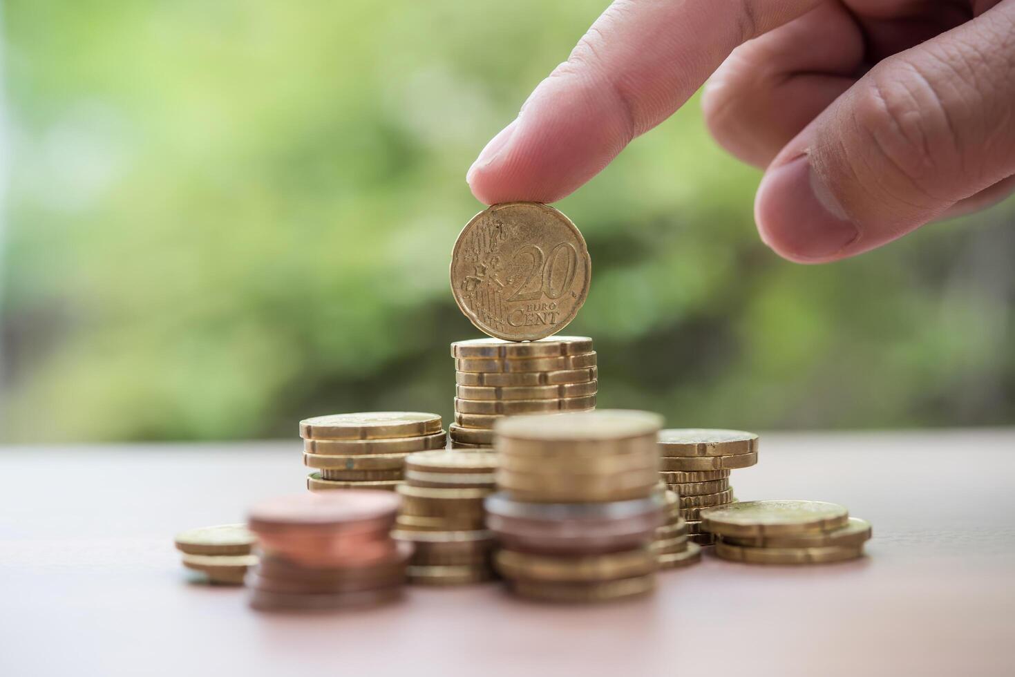 Saving money concept . hand putting money coin stack photo