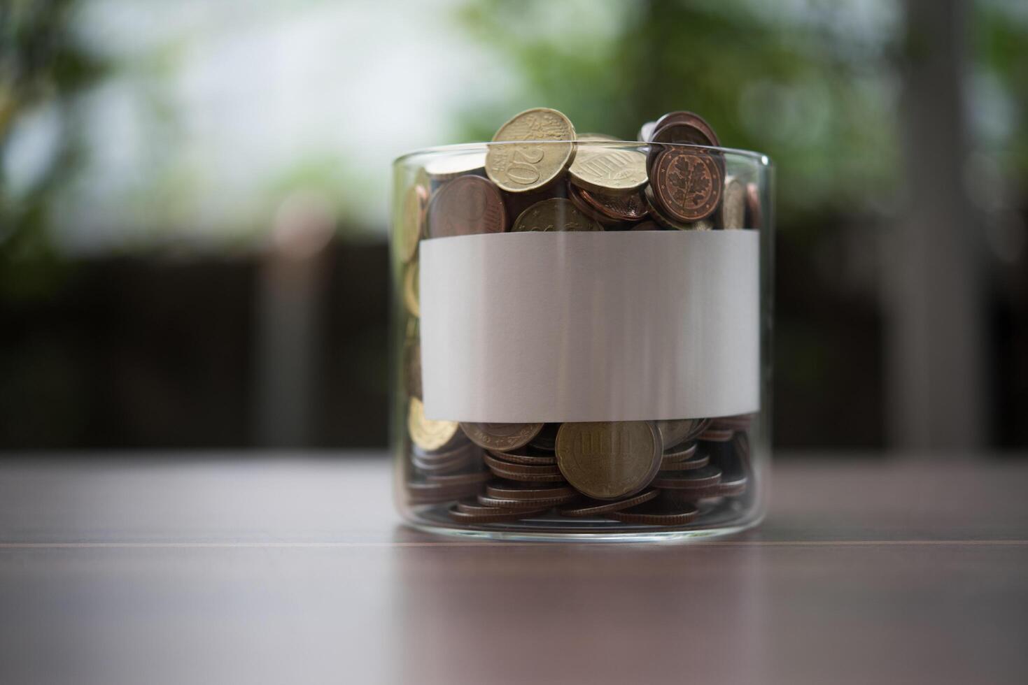 save money for investment concept coin in the glass jar photo