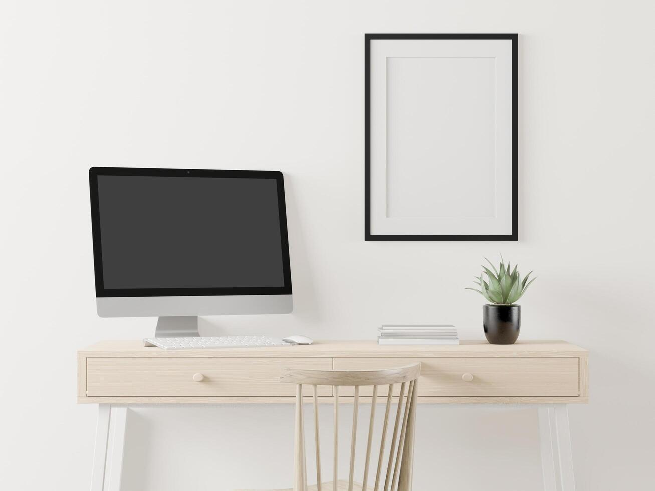 A working room with a computer placed on the table photo